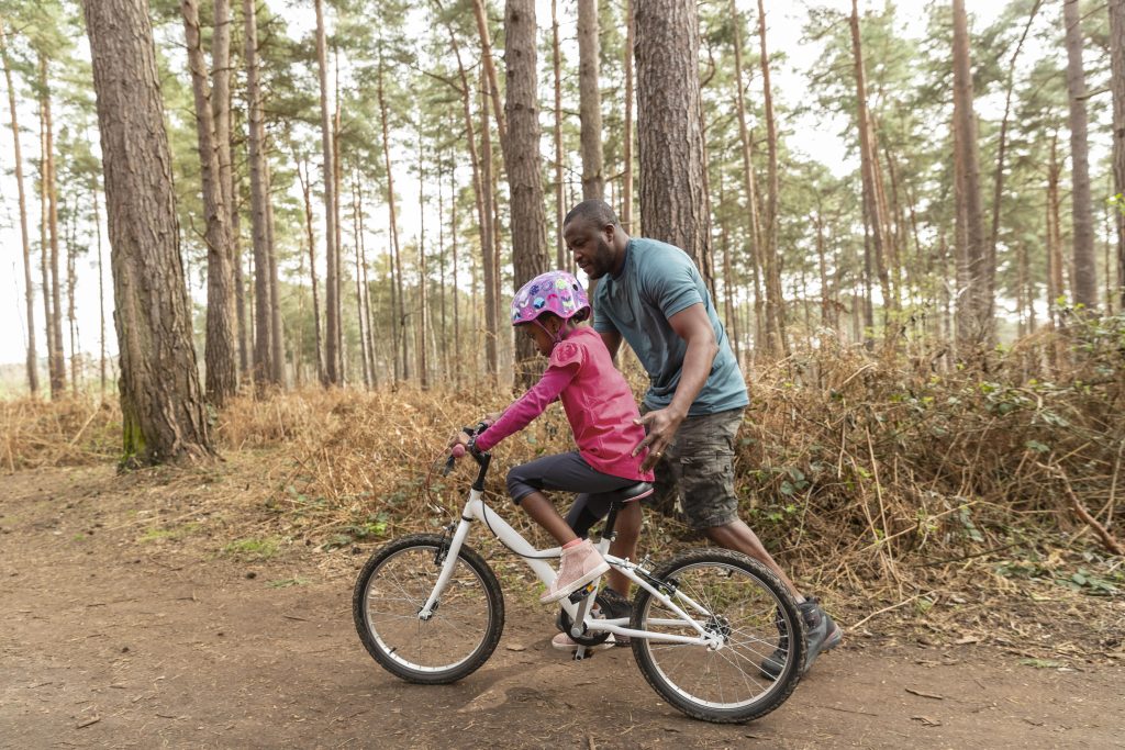 father-preparing-his-kid-bicycle-ride